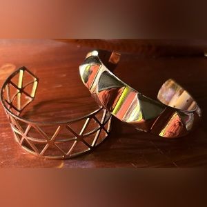 Set of two gold tone bangle bracelets.
